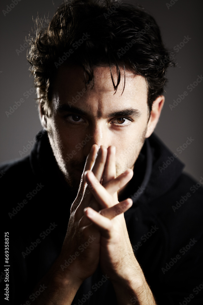 Dark, mystery and portrait of a man on a black background for agent, detective or spy work. Young, looking and a person with the mafia on a backdrop for a target, fear or staring on a backdrop Dark, mystery and portrait of a man on a black background for agent, detective or spy work. Young, looking and a person with the mafia on a backdrop for a target, fear or staring on a backdrop