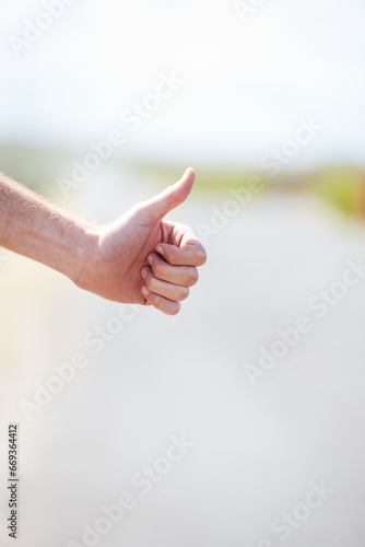 Person, travel and hitchhike on highway for car, stop and adventure on road trip with transportation for freedom. Man, vacation and help with journey, countryside and hand sign in cape town in mockup © Robert/peopleimages.com
