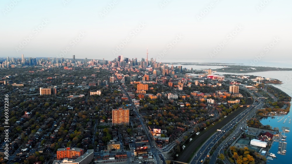 Panoramic aerial view of metropolis in Canada in autumn. Dynamic video, breathtaking noisy metropolis and green tree crowns decorate city. Don't let metropolis make you unhappy, enjoy nature around