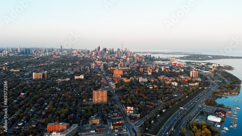 Panoramic aerial view of metropolis in Canada in autumn. Dynamic video, breathtaking noisy metropolis and green tree crowns decorate city. Don't let metropolis make you unhappy, enjoy nature around