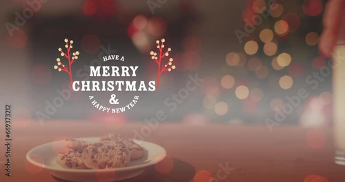 Animation of merry christmas and a happy new year text, cropped hand keeping cookies and milk glass