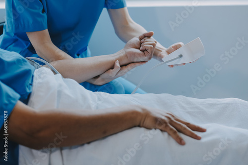 Women Asian doctors hold the patient hand and encourage and provide medical advice While checking the patient health in bed. Concept of Care and compassion, antenatal care, Threatened abortion