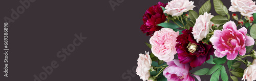 Floral banner  header with copy space. Roses and peony isolated on dark  background. Natural flowers wallpaper or greeting card.