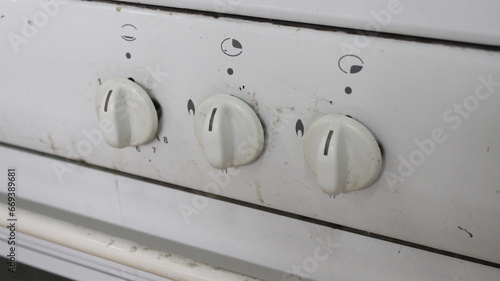 Close-up of dirty oven controls