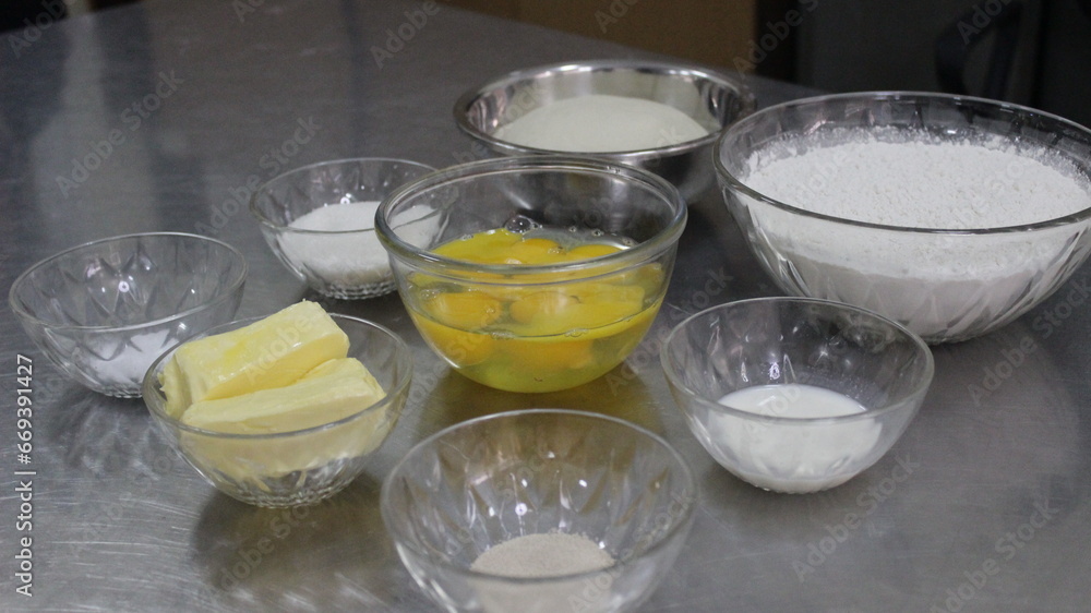Ingredients for baking cakes on stainless steel table side view background Ingredients for baking cakes on stainless steel table side view background