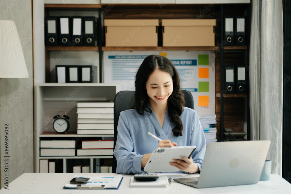 Asian business woman have the joy of talking on the smartphone, tablet and laptop video call on the modern office Asian business woman have the joy of talking on the smartphone, tablet and laptop video call on the modern office