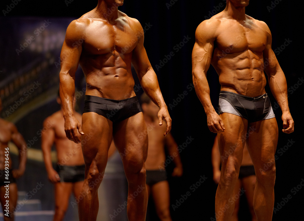Man, fitness and line of professional bodybuilder on stage for sports, judge or competition. Male person or muscular group of models standing in confidence, underwear or lingerie for contest - obrazy, fototapety, plakaty 