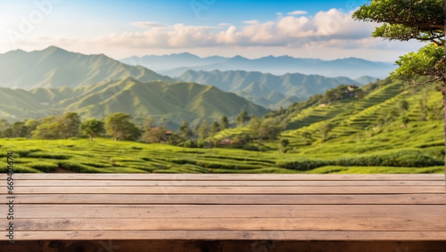 close up empty wooden desk with blurred background of tea garden on the mountain