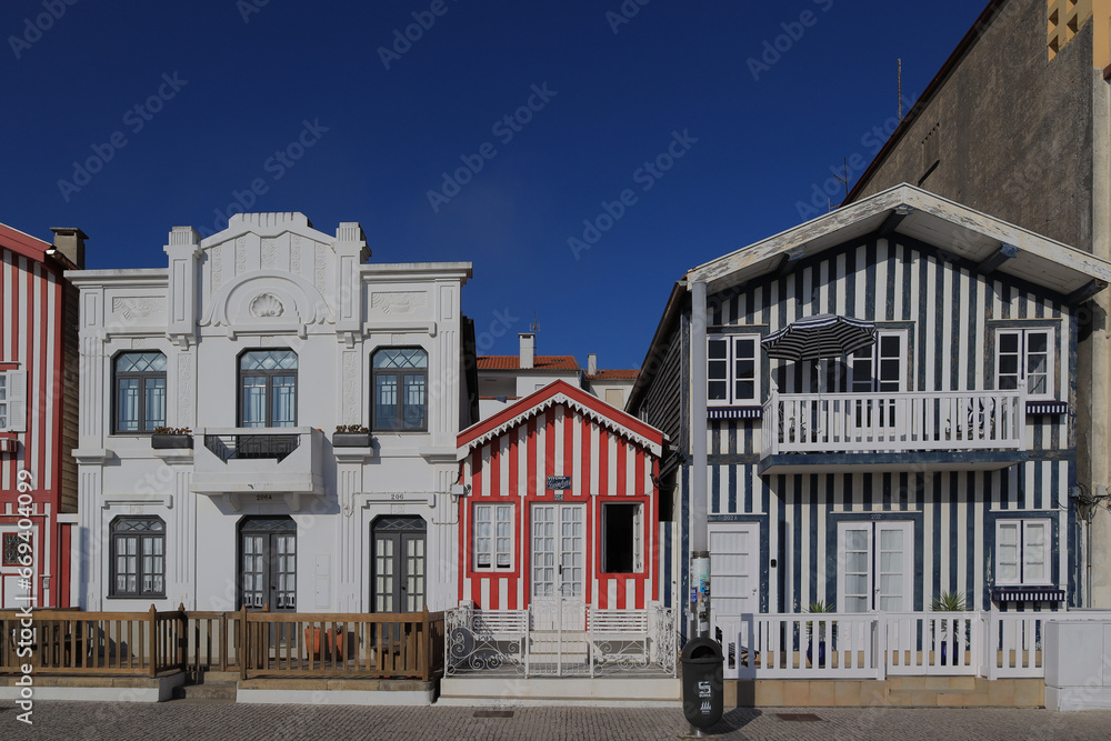 Street with colorful houses. Street with striped houses, Costa Nova, Aveiro, Portugal. Facades of colorful houses in Costa Nova, Aveiro, Portugal.