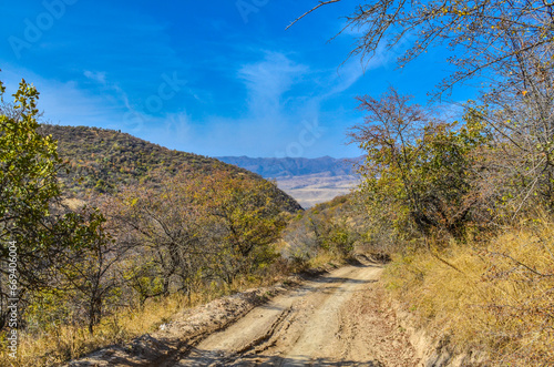 dirt road in the mountains of Kungurbuka ridge near Karankul village (Tashkent region, Uzbekistan) photo