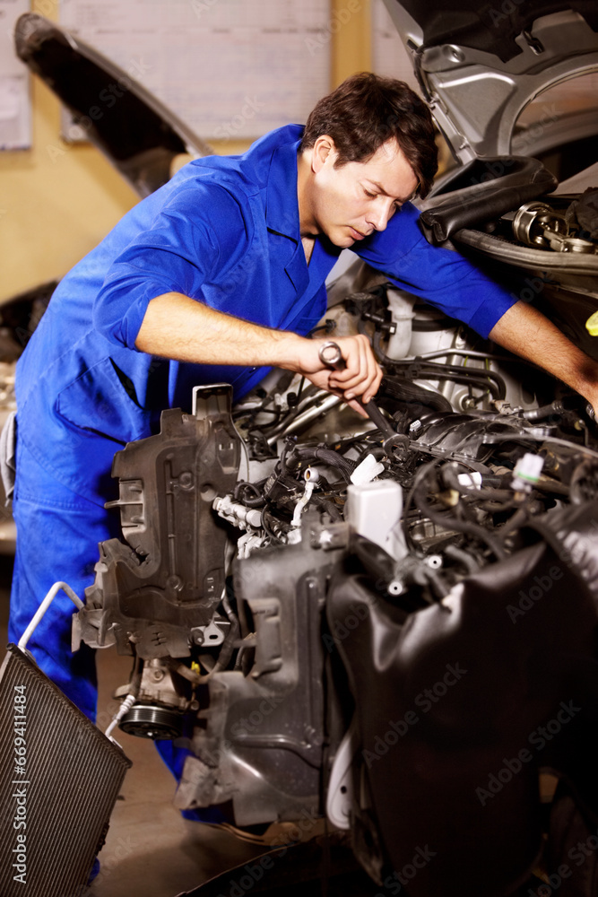 Spanner, man and mechanic check engine of car, repair or maintenance. Wrench tools, technician and serious person on motor vehicle, fix transportation or inspection at auto service workshop or garage Spanner, man and mechanic check engine of car, repair or maintenance. Wrench tools, technician and serious person on motor vehicle, fix transportation or inspection at auto service workshop or garage
