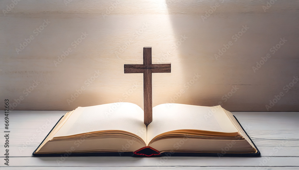 Open book Bible and cross on a light background. Open book Bible and cross on a light background.