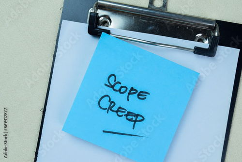 Obraz na plátně Concept of Scope Creep write on sticky notes isolated on Wooden Table