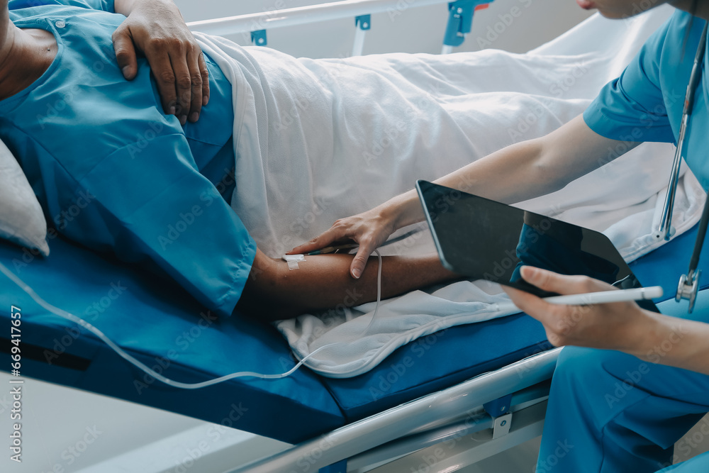 Injured patient showing doctor broken wrist and arm with bandage in hospital office or emergency room. Sprain, stress fracture or repetitive strain injury in hand. Nurse helping customer. First aid. Injured patient showing doctor broken wrist and arm with bandage in hospital office or emergency room. Sprain, stress fracture or repetitive strain injury in hand. Nurse helping customer. First aid.