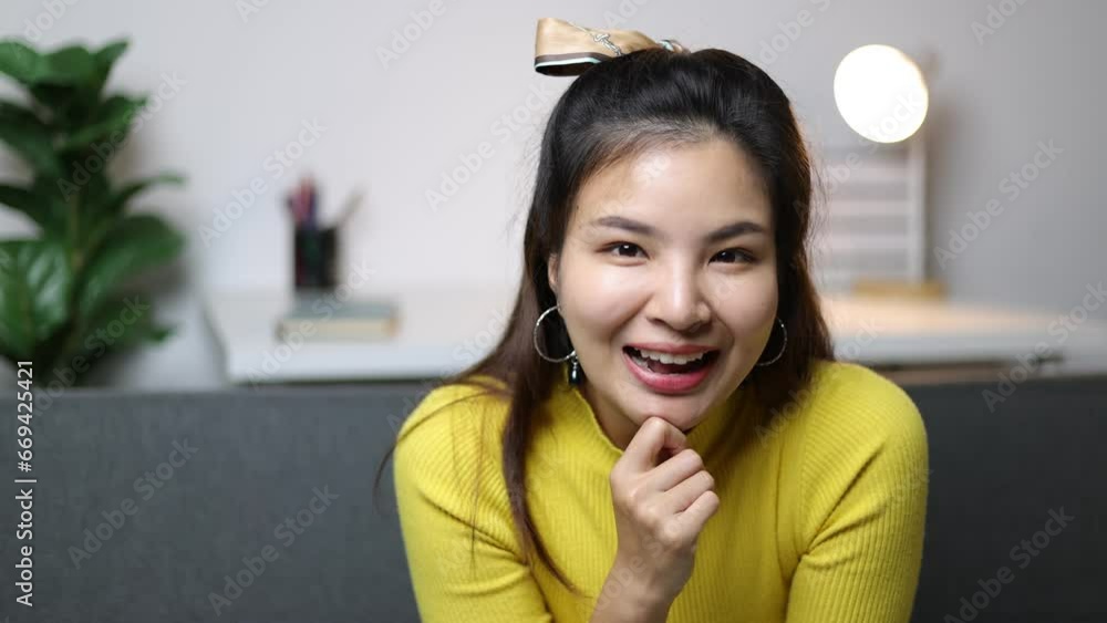 A cute and cheerful Asian girl woman is smiling and flirting. A cute and cheerful Asian girl woman is smiling and flirting.