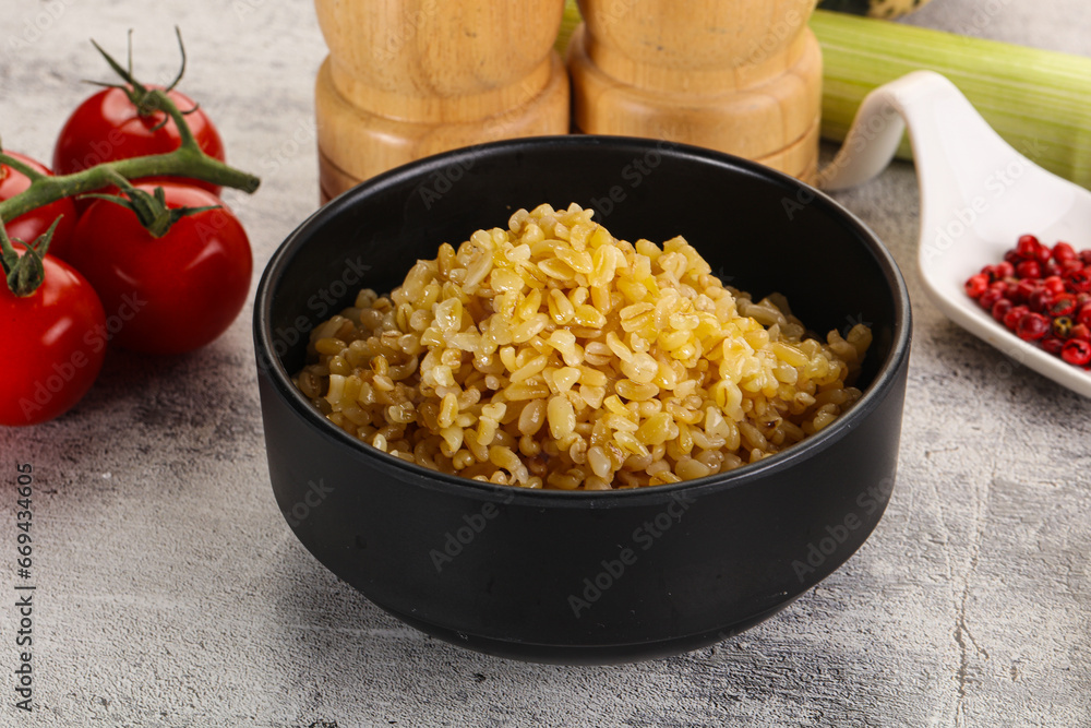 Boiled bulgur wheat in the bowl Boiled bulgur wheat in the bowl
