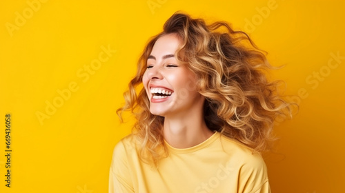 blonde woman laughs, colored background