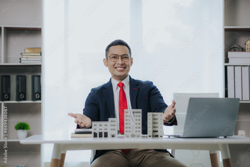 Real estate agents offer condos to clients. A real estate agent is talking with a client about buying and selling assets, houses, condos. Real estate agents offer condos to clients. A real estate agent is talking with a client about buying and selling assets, houses, condos.