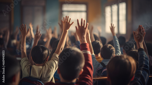 The students in the classroom raised their hands to compete to answer the teacher's question.