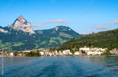 A view from the lake Urnersee or Lake Luzerne at Brunnen, a town in the political municipality of Ingenbohl, located on Lake Lucerne in the Schwyz district of the canton of Schwyz in Switzerland. photo