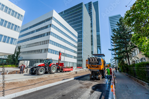 BASEL, SWITZERLAND - July 11 2023: The road service activity near Roche business headquarters, ensuring smooth transportation and timely deliveries for Roche company.