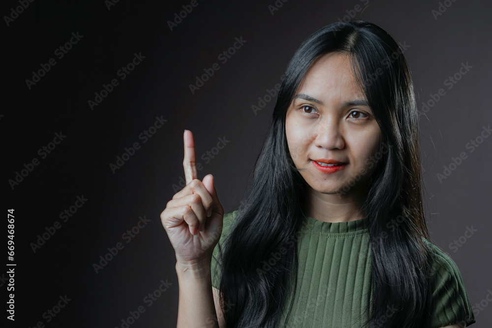 Photo of female person showing her finger up Photo of female person showing her finger up