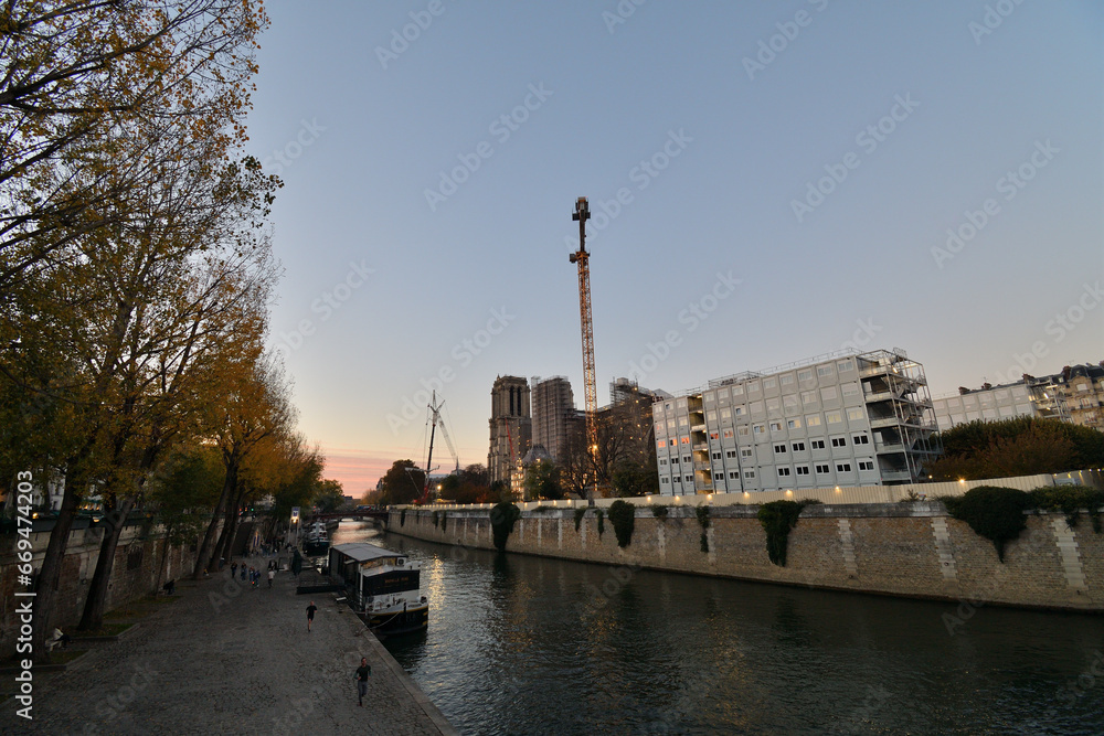 Paris, France. Notre Dame Cathedral under reconstruction at dusk. November 13, 2022.