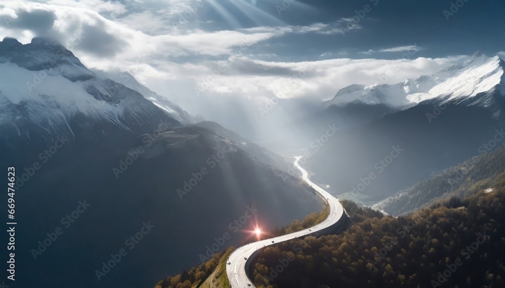  "Route montagneuse sous un ciel dramatique : lumière divine sur les Alpes - obrazy, fototapety, plakaty 