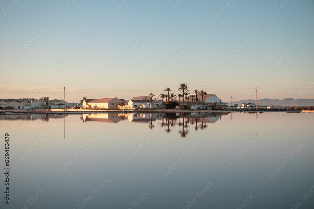 Reflection in the calm water of the salt complex of the Salinas Regional Park of San Pedro del Pinatar, Region of Murcia, Spain