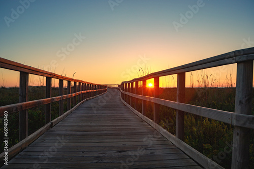 Wooden walkway at sunrise in the Salinas de San Pedro regional park in the Region of Murcia  Spain