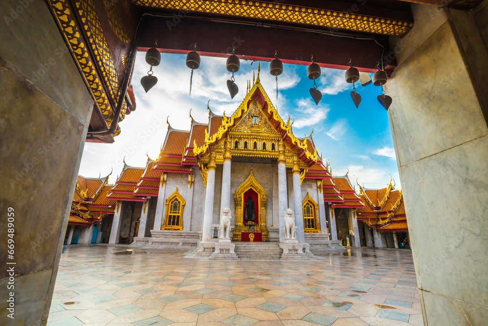 Fototapeta premium Marble buddha temple with golden pagoda sightseeing travel in Bangkok city
