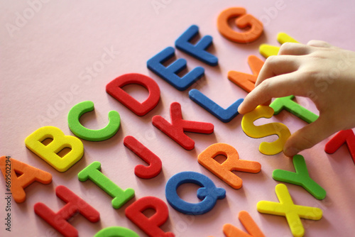 english alphabet. kid playing alphabet letters. Intellectual game, preschool primary education, early development