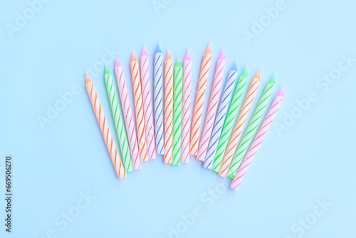 Multicolored birthday candles on blue background, Colorful candles party