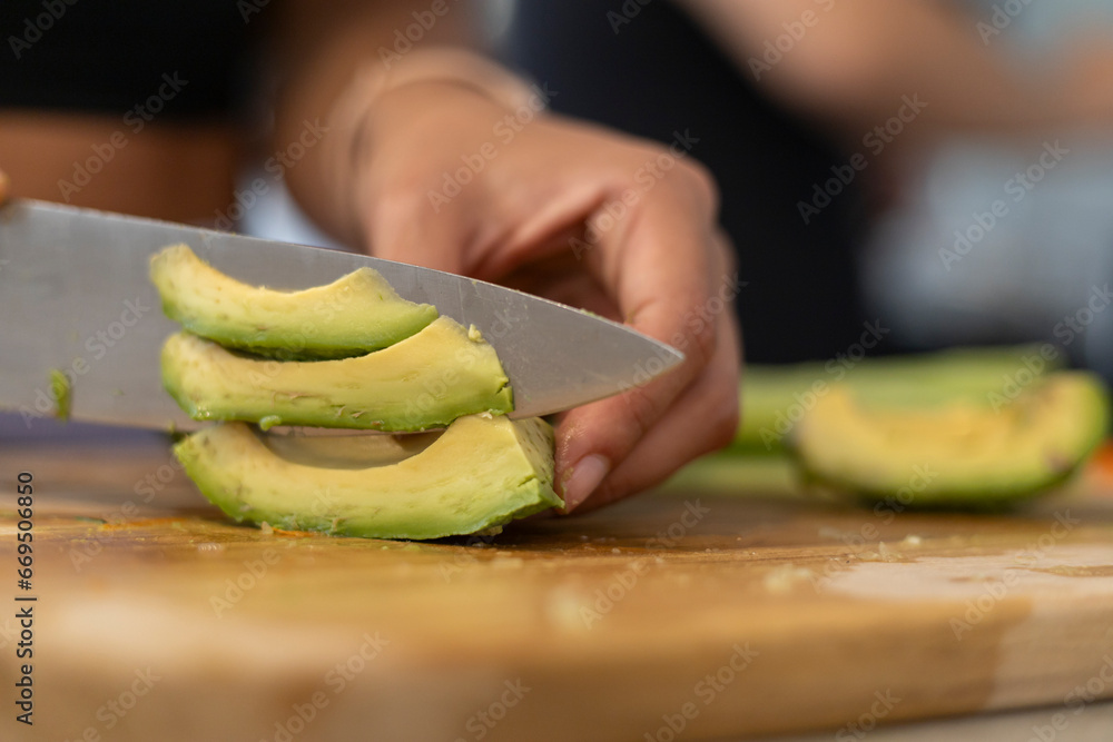 Women eat avocado to reduce bad cholesterol levels in the blood and increase good cholesterol Women eat avocado to reduce bad cholesterol levels in the blood and increase good cholesterol