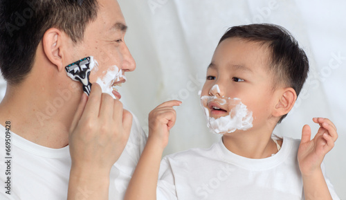 Father taught his son to shave photo