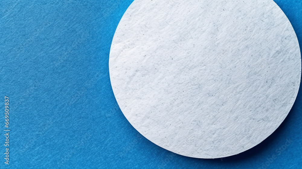 White round cut paper on blue with minimal composition, paper texture background, eco friendly and sea water concept, abstract background. White round cut paper on blue with minimal composition, paper texture background, eco friendly and sea water concept, abstract background.