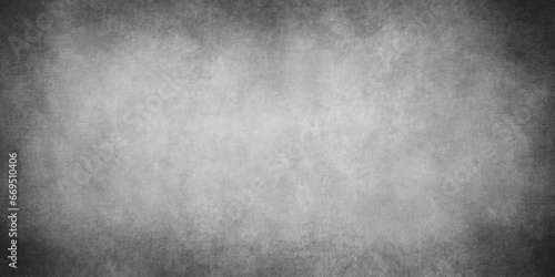 Abstract design with grunge black and white background . Old cement wall . scary dark texture of old paper parchment and .decorative plaster or concrete with vignette  paper texture design .Dark wall 