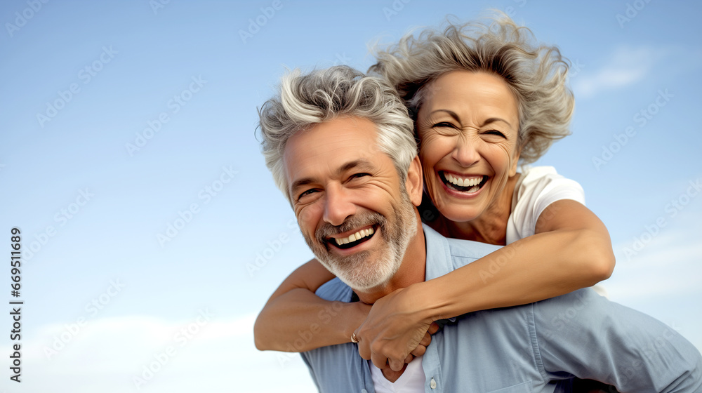 LAUGHING MATURE MAN GIVING HIS WIFE PIGGYBACK RIDE. legal AI