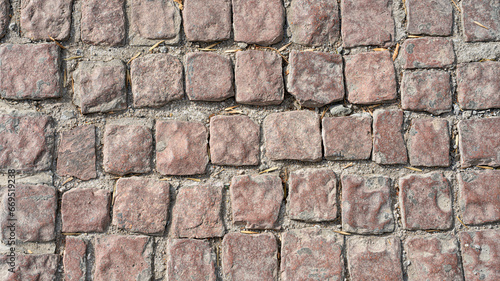 Stone pavement texture. Abstract background of cobblestone pavement