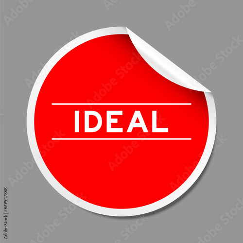 Red color peel sticker label with word ideal on gray background