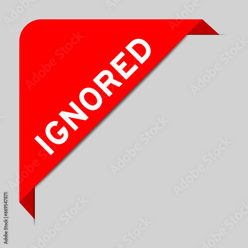 Red color of corner label banner with word ignored on gray background