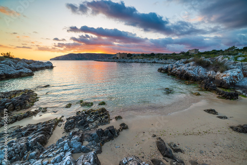 Obraz na płótnie Sunset sky over beautiful beach and water bay in the greek spectacular coast line. Reflection on water, unique rocky cliffs, Greece summer top travel destination Mani peninsula Peloponnese w salonie