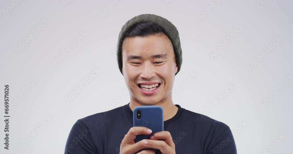 Happy man, phone and typing for communication, social media and online education chat on a white background. Young asian student laugh for funny meme, contact and mobile app for networking in studio Happy man, phone and typing for communication, social media and online education chat on a white background. Young asian student laugh for funny meme, contact and mobile app for networking in studio