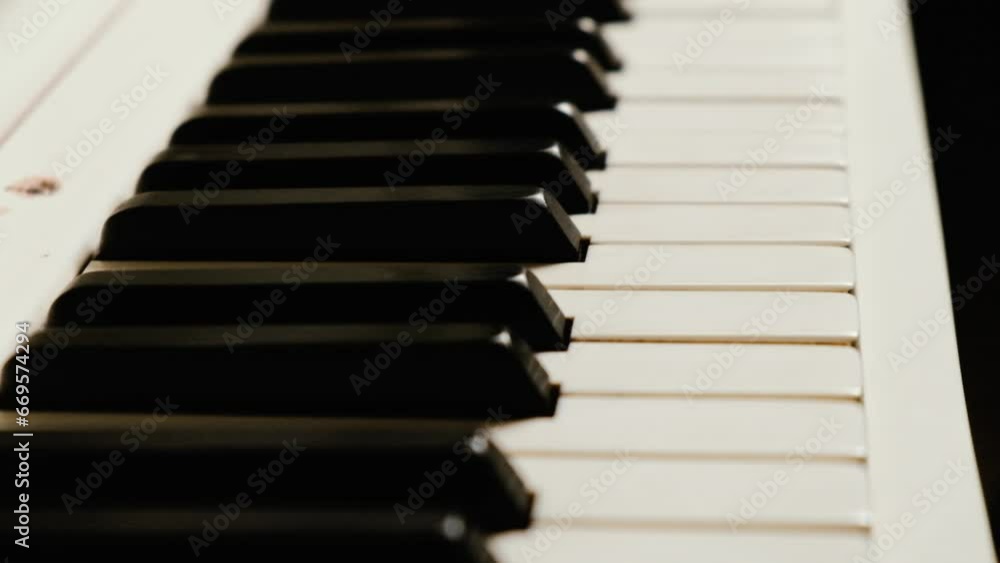 Piano keys close-up. Musical keyboard instrument. Selective focus.
