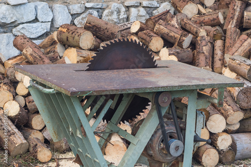 Old circular saw. A machine that is used to cut wood.