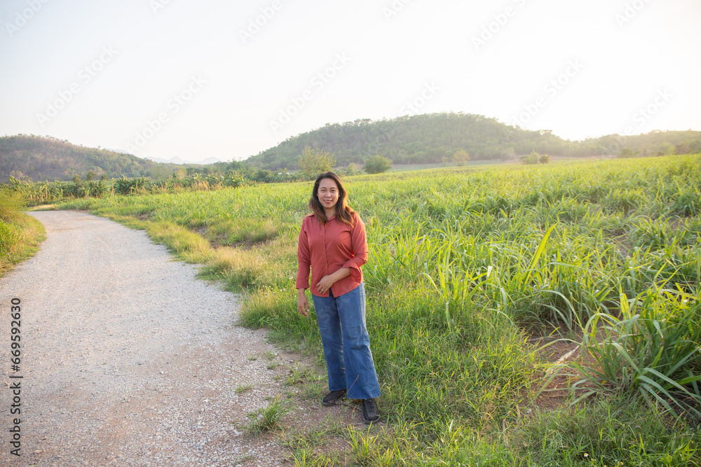 women asian standing on the countryside road