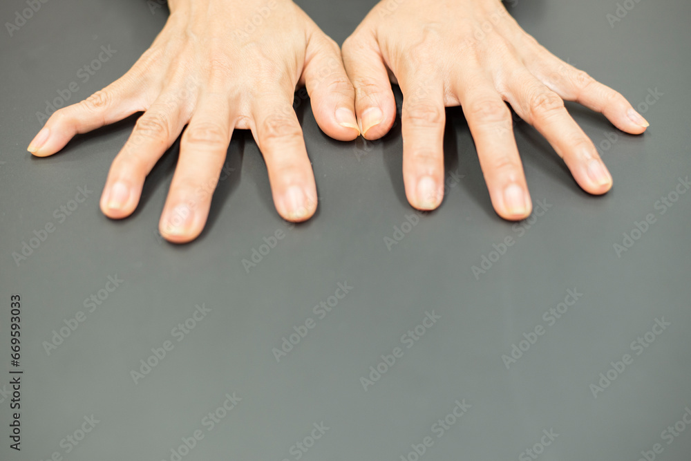 close up of a female hands holding her fingers