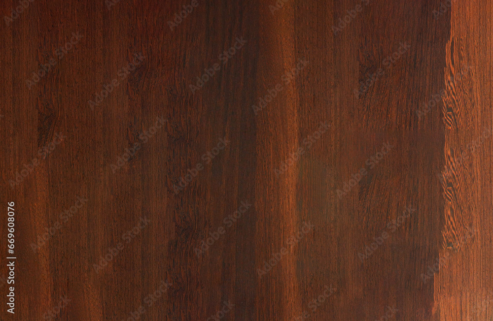 Naklejka premium A close-up view of a wooden surface with a dark brown finish
