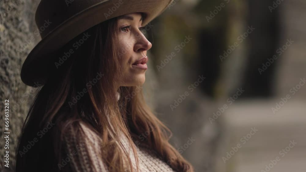A beautiful lady in a cowboy hat, face close up in slow motion, beautiful facial features, lips, and eyes. Hair and a sultry gaze. Beauty and cinema concept. Warm colors. Woman. Cinematic A beautiful lady in a cowboy hat, face close up in slow motion, beautiful facial features, lips, and eyes. Hair and a sultry gaze. Beauty and cinema concept. Warm colors. Woman. Cinematic