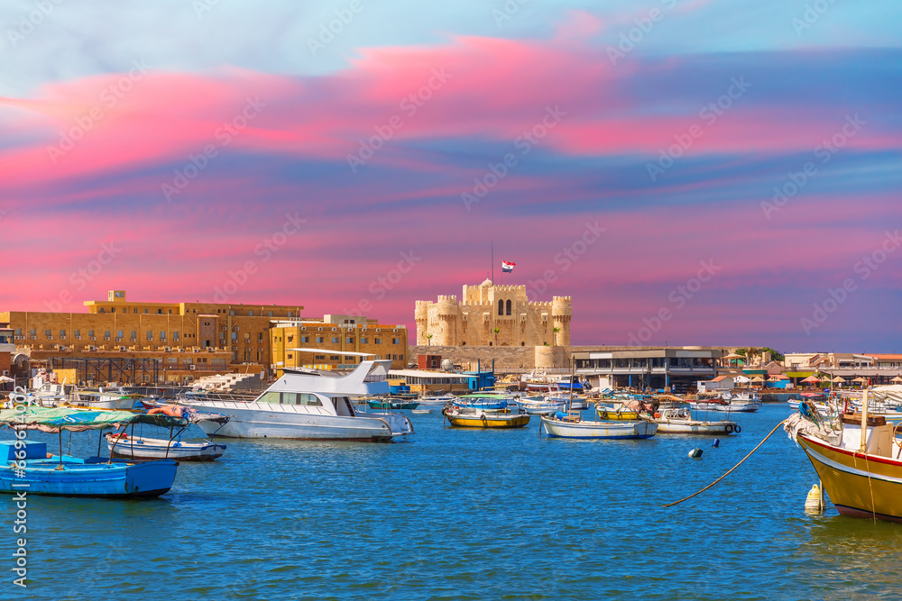 Citadel of Qaitbay, famous fort in the Mediterranean harbour of Alexandria, beautiful sunset view, Egypt